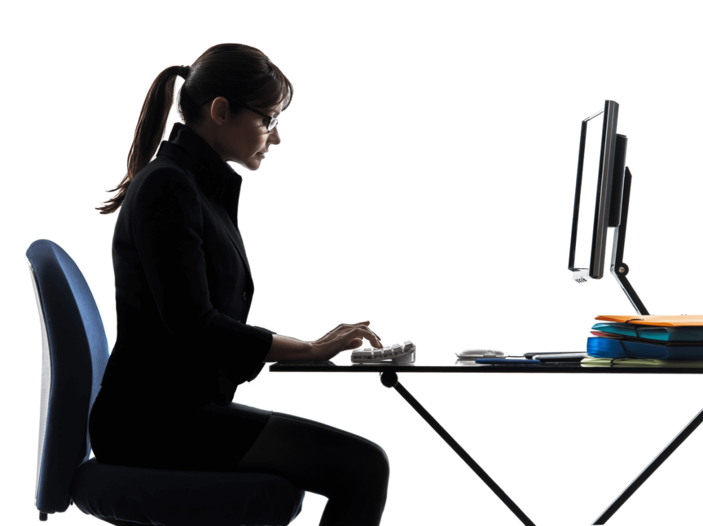 women typing at desk